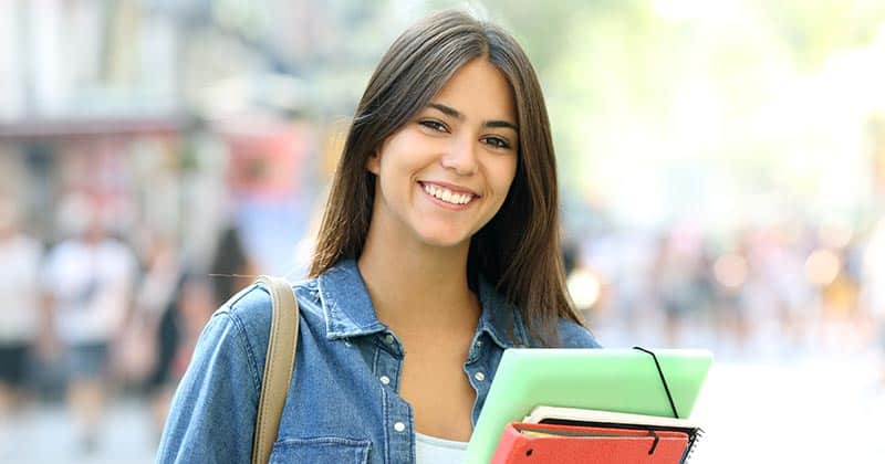 College student holding books